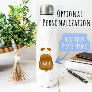 May include: White insulated water bottle with a silver cap. A sticker of a bulldog's rear end is on the bottle, with the name "Charlie" printed on it. Text on the bottle reads "Optional Personalization" and "Add Your Pup's Name".