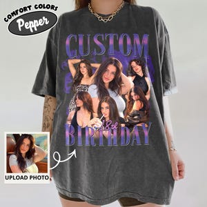 May include: A charcoal grey short-sleeve t-shirt featuring a collage of photographs of a young woman. The text CUSTOM 18th BIRTHDAY is printed in a purple gradient font. A small inset box shows the original photo with the text UPLOAD PHOTO.