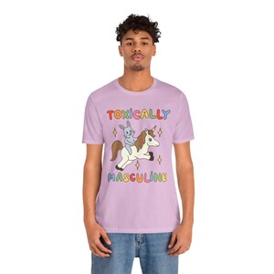 Funny graphic tee featuring the phrase "Toxically Masculine," delivering an ironic and satirical take on toxic masculinity.