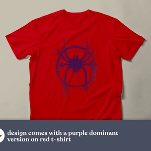 May include: A red t-shirt with a purple spider-man symbol printed on the front.