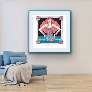 May include: A framed illustration of the zodiac sign Scorpio. The illustration features a woman with red hair and a blue and pink scorpion tail. The background is a dark blue with pink stars. The text "Scorpio" and "October 23 - November 21" is printed below the illustration.