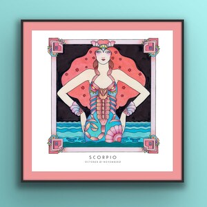 May include: A framed illustration of the Scorpio zodiac sign. The illustration features a woman with red hair and a scorpion tail, standing in a blue and turquoise ocean. The text "Scorpio" and "October 23 - November 22" is printed below the illustration.
