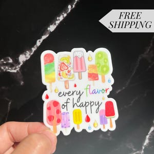 May include: A white sticker with a colorful illustration of popsicles and the text "every flavor of happy".