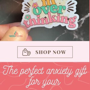 May include: A sticker with the text "I have a PhD in overthinking" in pink, green, and yellow lettering with a flower design. The sticker is on a white travel mug with a handle.