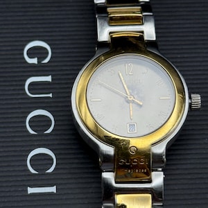 Vintage Gucci Wrist watch Swiss Ladies Logo Calendar Dial Gold plated Boxed Stainless Boxed Warranty Guarantee Great Vintage condition