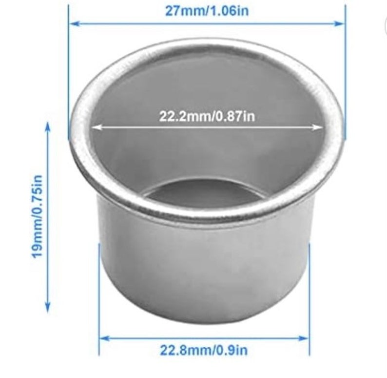 May include: A silver metal baking mold with measurements in inches. The mold is 0.87 inches in diameter and 0.75 inches tall. The mold is 0.9 inches wide.