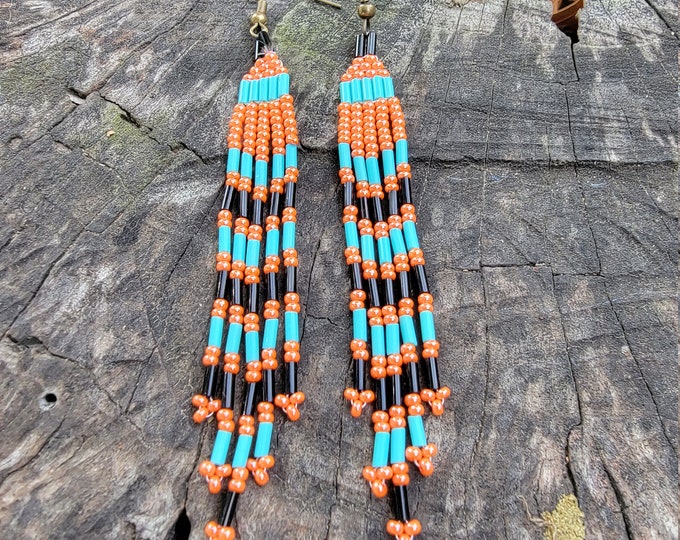 Handmade, 4" long, beaded earrings, 5 Multi-length strands of Coral, Black, Turquoise giving them a casual Southwestern look.