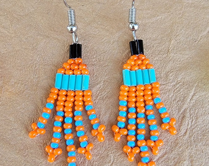 Small, short fringed, handmade, beaded dangle pierced earrings in a variety of candy corn colored, oranges, yellow and blue combinations