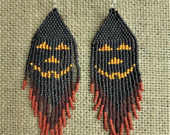 Deliciously devious, dark looking, handmade, beaded 4" long fringe pumpkin earrings for all your Halloween outings by Be Dazzled Earrings.
