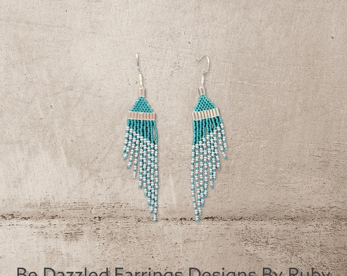 Wing shaped earrrings. Shimmer with these Stunning, Turquoise, Silver handmade, beaded, 4" long medlium length wing shaped dangle earrings.