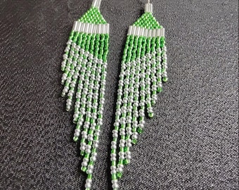 Get Sparkling Elegance with these Green and Silver, multi-length, 4" long, fringed, wing shaped, handmade, beaded earrings for pirced ears.