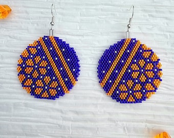 Bright Orange and Dark Purple, handmade beaded round bulb shaped dangle earrings by Be Dazzled Earrings, perfect for the holidays.
