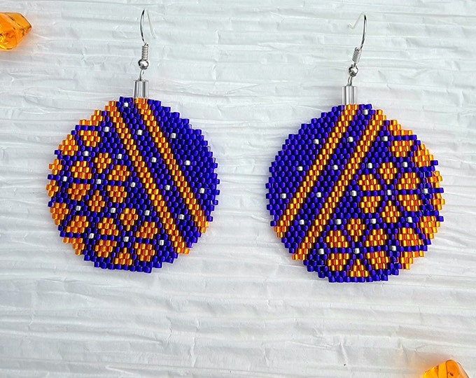 Bright Orange and Dark Purple, handmade beaded round bulb shaped dangle earrings by Be Dazzled Earrings, perfect for the holidays.