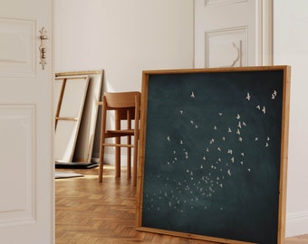 May include: A framed print with a dark blue background and white silhouettes of birds flying in a flock. The frame is made of wood and has a natural finish.