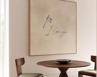 May include: A beige canvas print with the text "ps I love you" in black cursive handwriting. The print is hanging on a white wall above a round wooden table with two chairs.