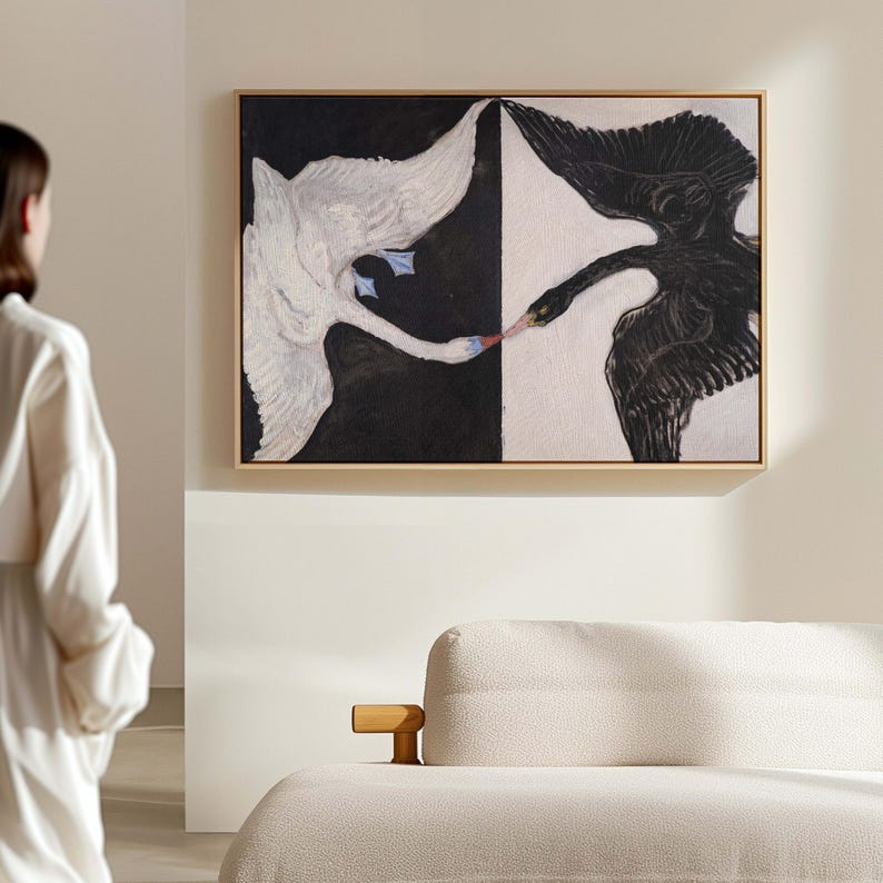 May include: A painting of two swans, one white and one black, facing each other with their beaks touching. The white swan is on the left side of the painting and the black swan is on the right. The background is a black and white abstract design.