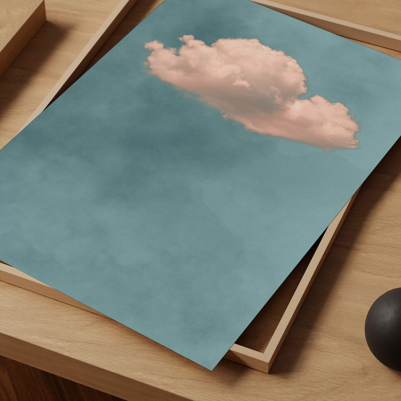 May include: A single, fluffy, pink cloud against a light blue sky.
