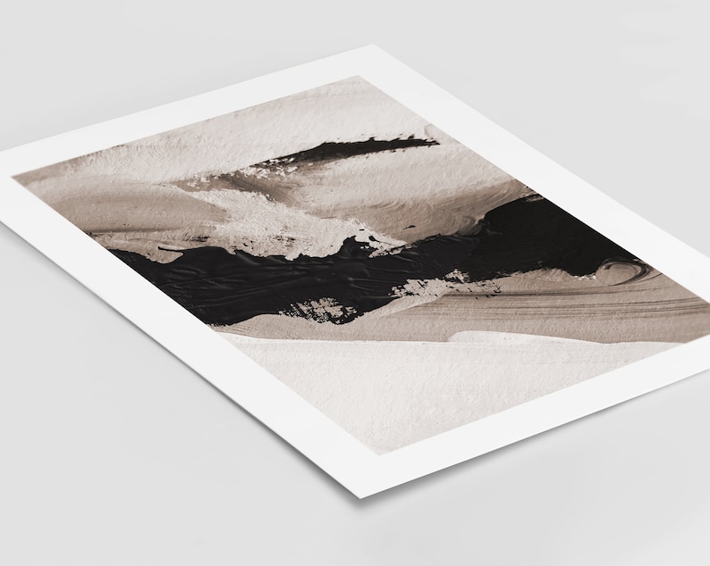 May include: Abstract art print with black and brown paint strokes on a white background.