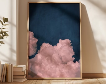 May include: A framed print of a pink cloud formation against a dark blue sky. The clouds are fluffy and appear to be floating in the sky.