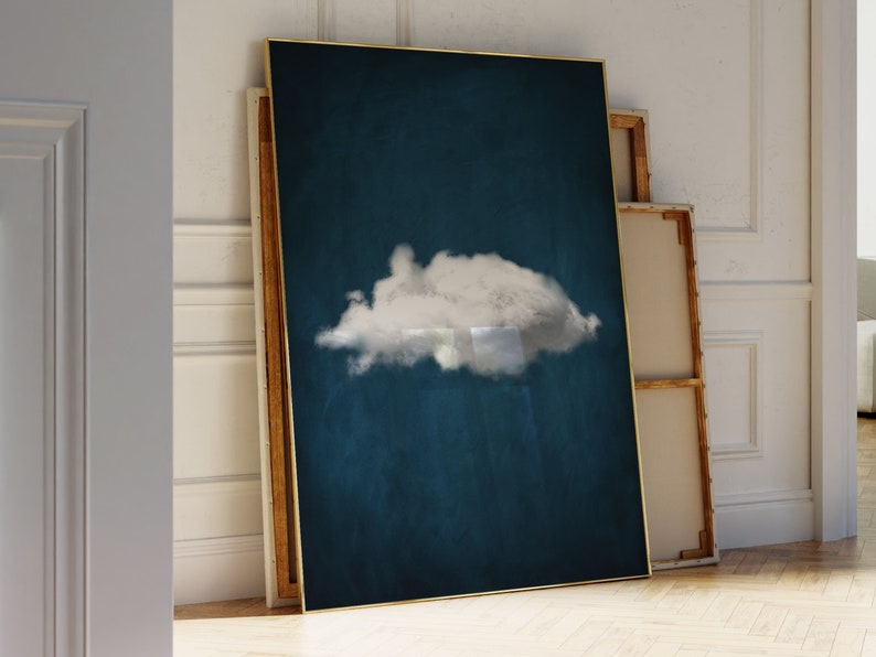 May include: A framed canvas print with a single white cloud on a dark blue background. The frame is gold.