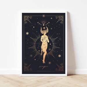 May include: A gold and white illustration of a woman with a crown of stars and a crescent moon above her head. The background is black with stars and the word "Scorpio" is written in gold at the bottom.
