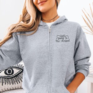 Bridal party getting ready outfit zip up hoodie, going to the chapel with front and back design. Personalized with bride's name and wedding date.