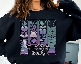 May include: Black sweatshirt with a colorful graphic of books, an owl, and a coffee cup. The text "No Such Thing As Too Many Books" is printed below the graphic. The design features purple, blue, and green hues.