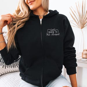 Bridal party getting ready outfit zip up hoodie, going to the chapel with front and back design. Personalized with bride's name and wedding date.