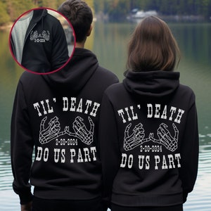 May include: Two black hoodies with white text and skeleton hand graphics. The text reads "Til' Death Do Us Part" with the date "2-20-2024" printed below the graphic.