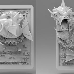 May include: Two grayscale 3D-printed Pokémon trading cards. One features Magikarp, the other, Gyarados. Both cards have embossed details, including text, HP, and attack information. The Magikarp card shows a fish with fins. The Gyarados card shows a serpentine dragon.