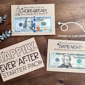 May include: Kraft cardstock gift cards with cash. One card reads "When you want to take a chore break" with a $100 bill. Another says "Happily Ever After Starter Pack." The third card reads "Game Night" with a $20 bill.