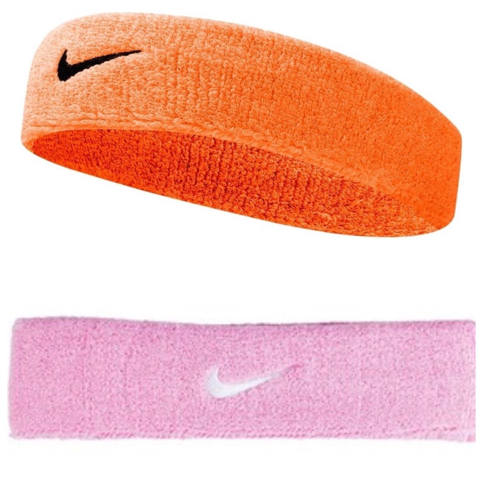 white nikes with orange swoosh