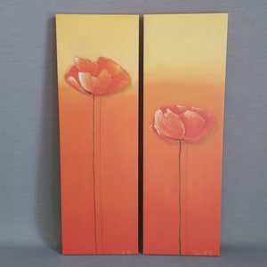 May include: Two orange and yellow canvas paintings with a single orange poppy flower on each. The flowers are painted in a realistic style.