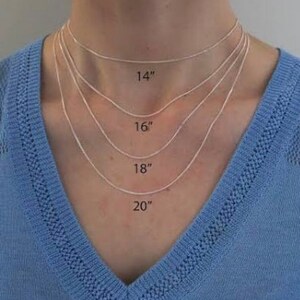 May include: A model wears four silver chains of different lengths, labeled 14", 16", 18", and 20".