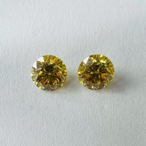 Fancy Intense Yellow | Jeweils 0,30cts | Naturdiamant | runde Form | 0,60ct ca Paar Größe