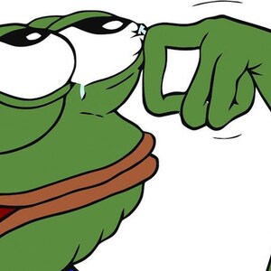 May include: A cartoon image of a green frog-like creature with large eyes and a sad expression. The creature is crying, with tears streaming down its face. A green hand is touching the creature's face.