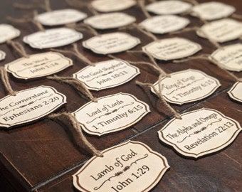 May include: A collection of wooden ornaments with various bible verses printed on them. The ornaments are in a rustic style and have a natural wood finish.