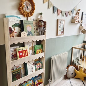 Scalloped wall mounted Montessori book shelf