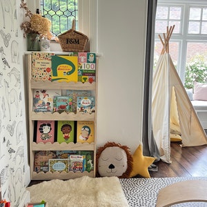 Scalloped wall mounted Montessori book shelf