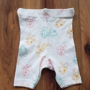 May include: A rustic wooden sign with the text "Welcome to our home" in white lettering. The sign has a distressed finish and a simple, inviting design, ideal for entryway decor.