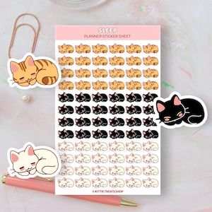 May include: A sheet of planner stickers featuring adorable sleeping cats in various colors, including orange tabby, black, and white. The stickers are perfect for adding a touch of whimsy to your planner or journal. The sheet includes the text "SLEEP PLANNER STICKER SHEET" and "KITTIE TREATS SHOP".
