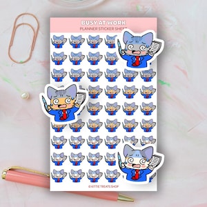 May include: A sticker sheet with 49 illustrations of a blue cat wearing a blue suit and holding a pen and a piece of paper. The cat has a surprised expression on its face. The text "Busy at Work Planner Sticker Sheet" is at the top of the sheet. The text "Kittie Treats Shop" is at the bottom of the sheet.