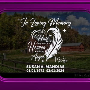 May include: White vinyl decal with a heart, feather, and cross. The text reads "In Loving Memory", "Half of my heart is in Heaven with my Angel", "Wife", "SUSAN A. MANDIAS", and "01/01/1972-03/01/2024".