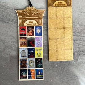 May include: Two wooden bookmarks with black tassels. One bookmark features a column design with the text "Lisa Bookmark" and miniature book covers. The other bookmark has the same column design and text, with a grid pattern.