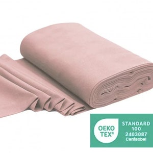 May include: A roll of light pink fabric with the Oeko-Tex Standard 100 certification label. The label has the number 2403087 and the text "Contexbel".
