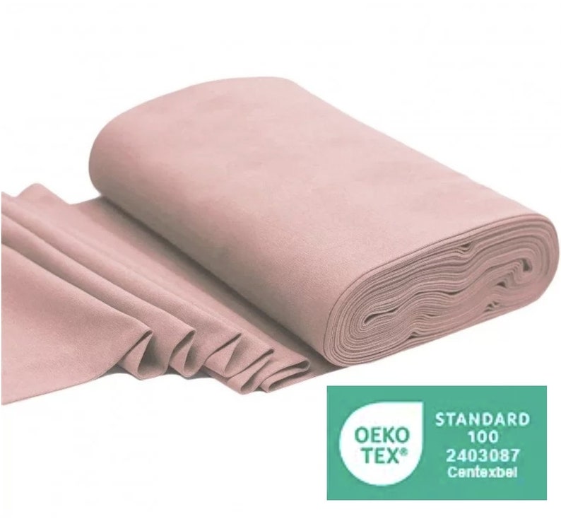 May include: A roll of light pink fabric with the Oeko-Tex Standard 100 certification label. The label has the number 2403087 and the text "Contexbel".