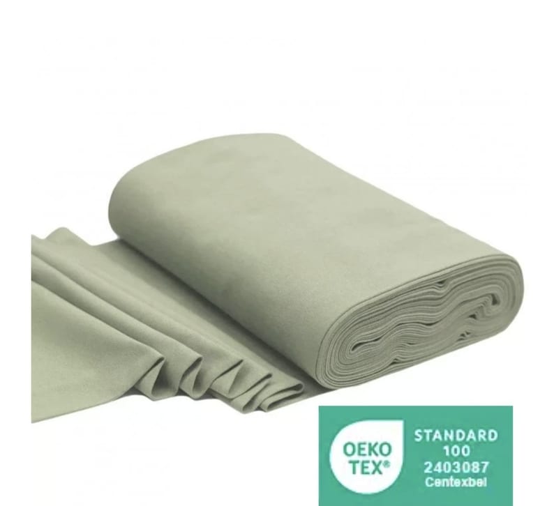 May include: A roll of light green fabric with the Oeko-Tex Standard 100 certification label. The label has the text "STANDARD 100" and the number "2403087" with the words "Contexbel" underneath.