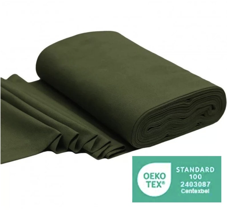 May include: A roll of dark green fabric with a label that reads "OEKO-TEX&reg; STANDARD 100 2403087  Contexbel".