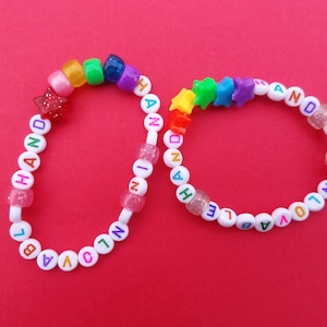 hand in unlovable hand bracelet