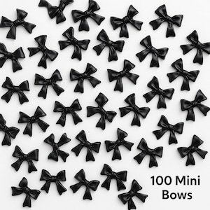 May include: A collection of small, glossy black bows arranged on a white surface. The bows are evenly spaced and have a classic bow shape. The text "100 Mini Bows" is visible in the lower right corner.